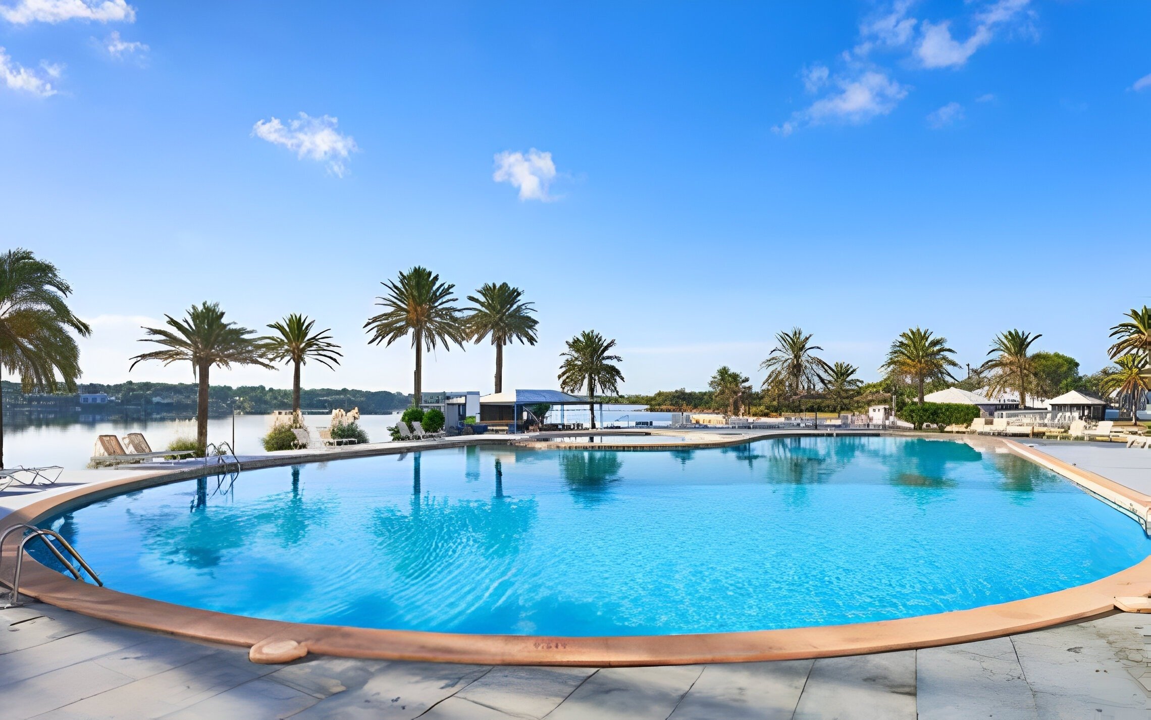 Palm-roofed bar, next to the outdoor pool and sea views at the Park Royal Beach Acapulco Hotel