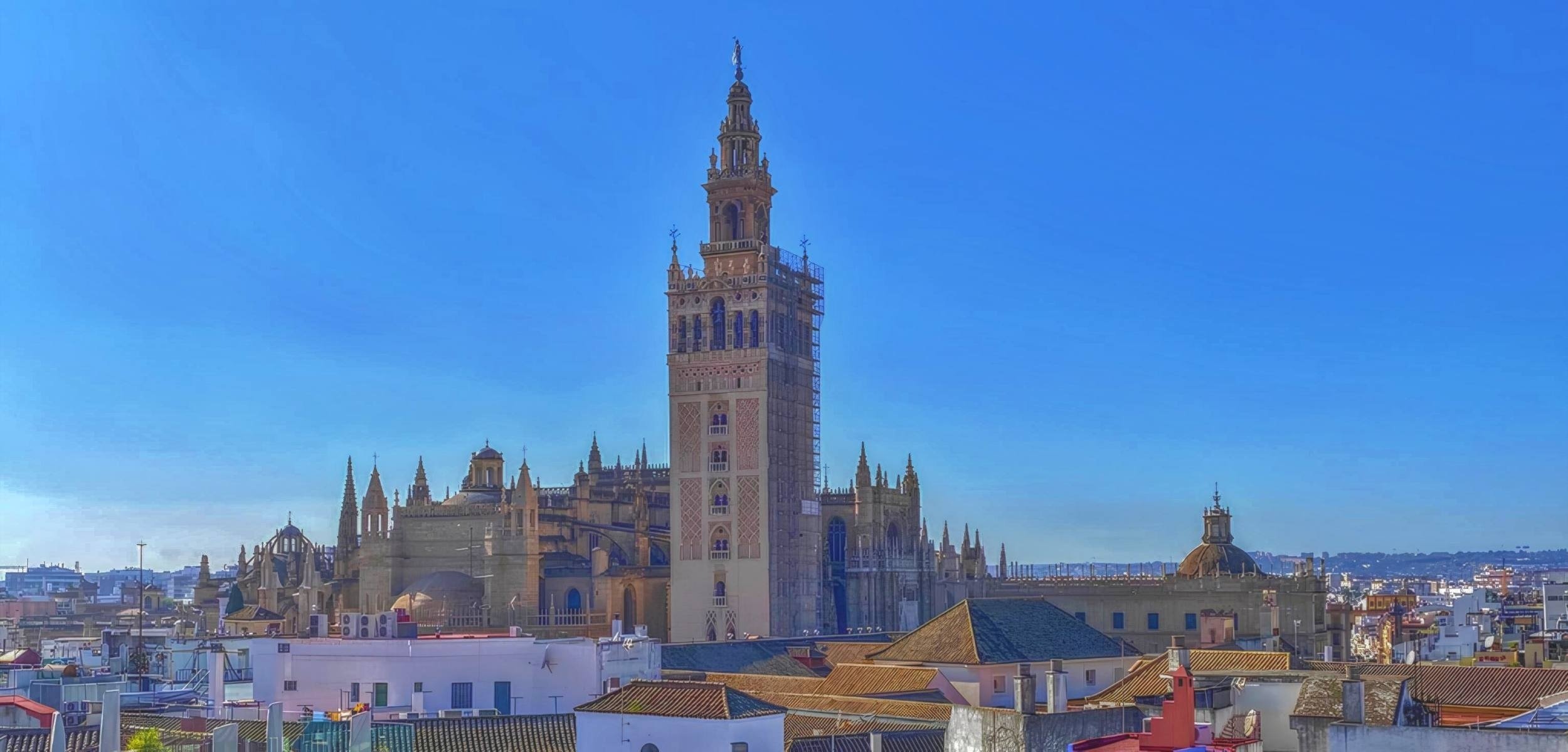 a very tall building with a blue sky in the background