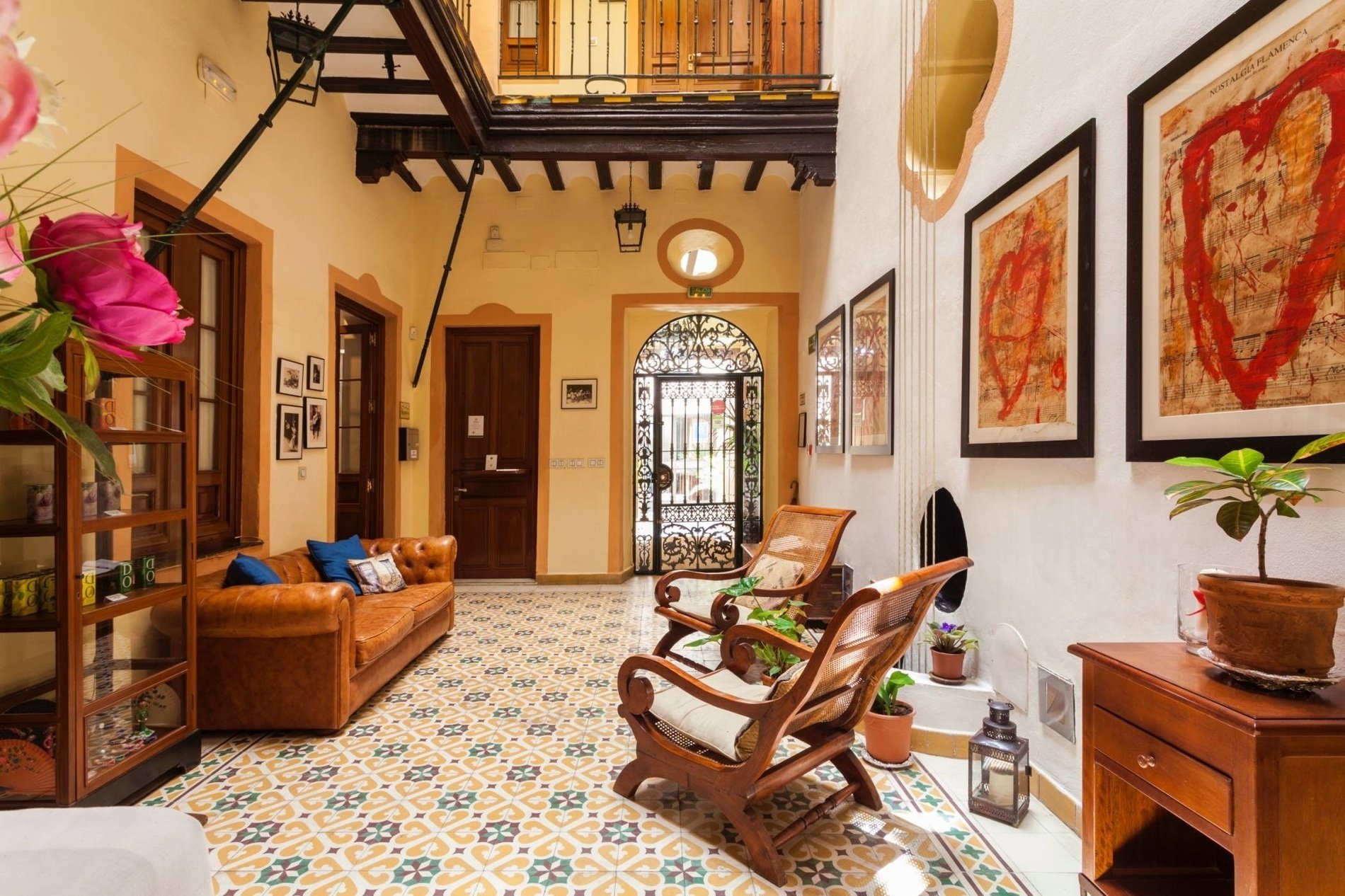 a living room with a brown couch and chairs