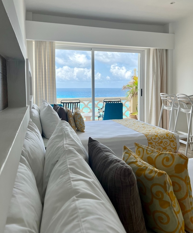 a hotel room with a view of the ocean