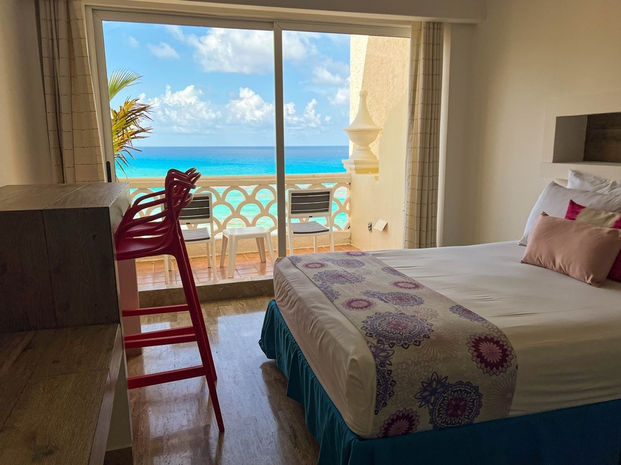 a hotel room with a view of the ocean