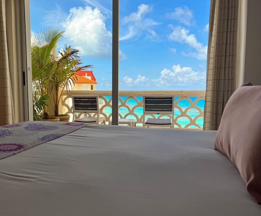 a view of the ocean from a hotel room