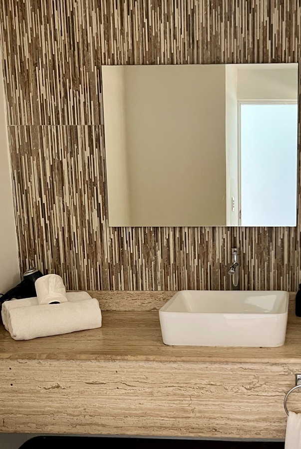 a bathroom with a sink and a mirror