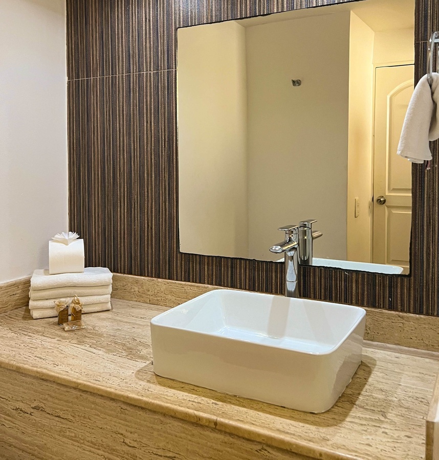 a bathroom with a sink and a large mirror