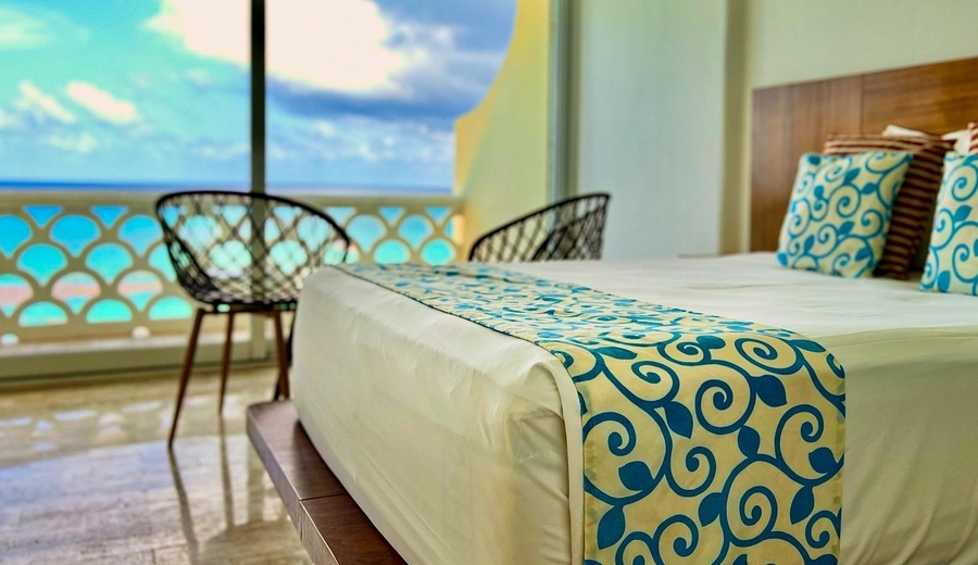 a bed with blue and yellow swirls on it