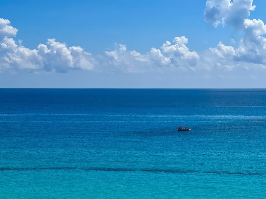 a boat in the middle of a large body of water