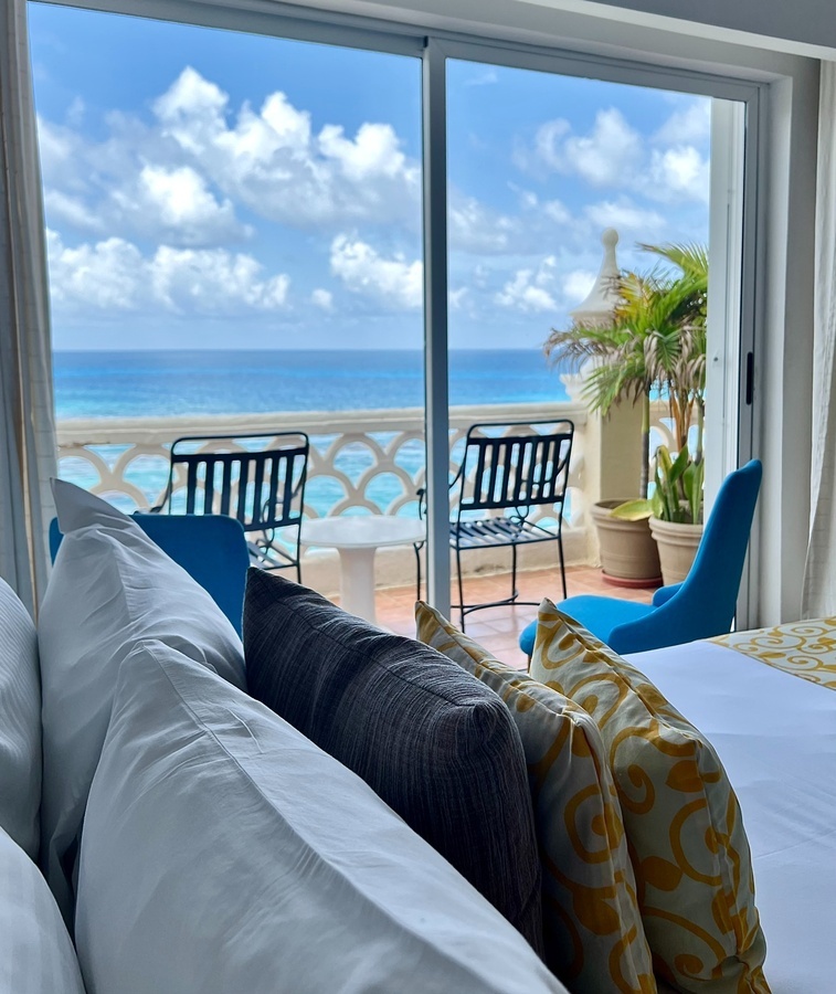 a hotel room with a view of the ocean