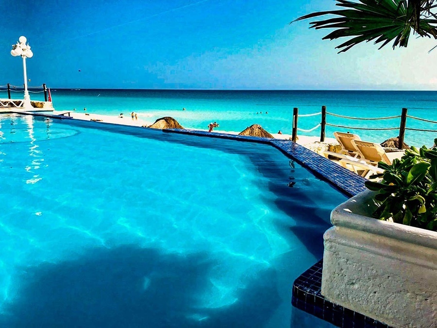 a swimming pool with a view of the ocean