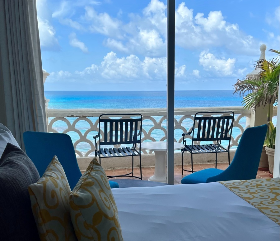 a view of the ocean from a hotel room