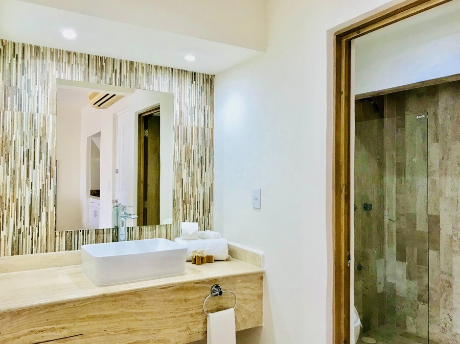 a bathroom with a sink and a large mirror