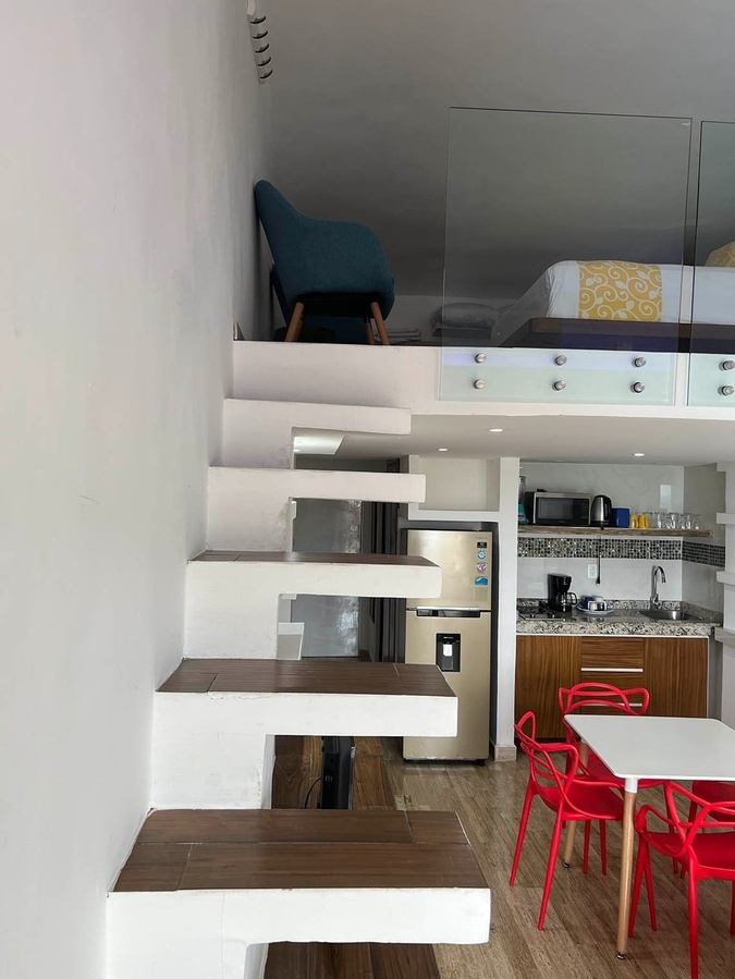 a kitchen with a refrigerator that says ' samsung ' on it