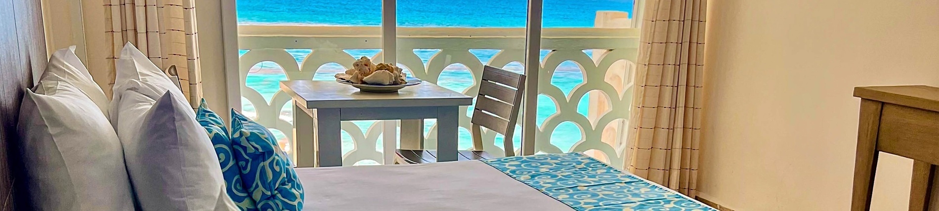 a hotel room with a view of the ocean