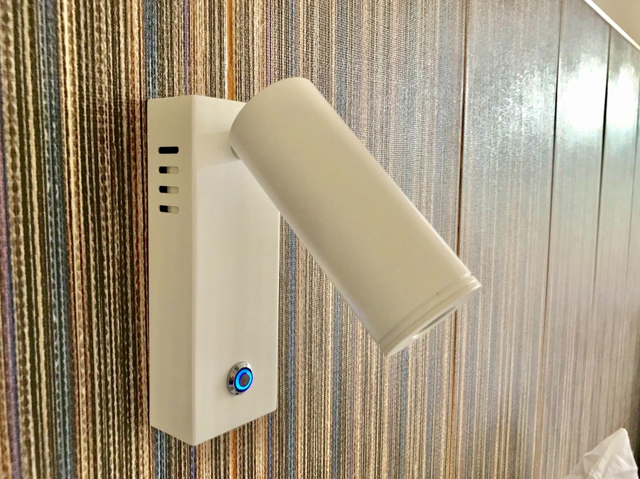 a white light with a blue button on the side