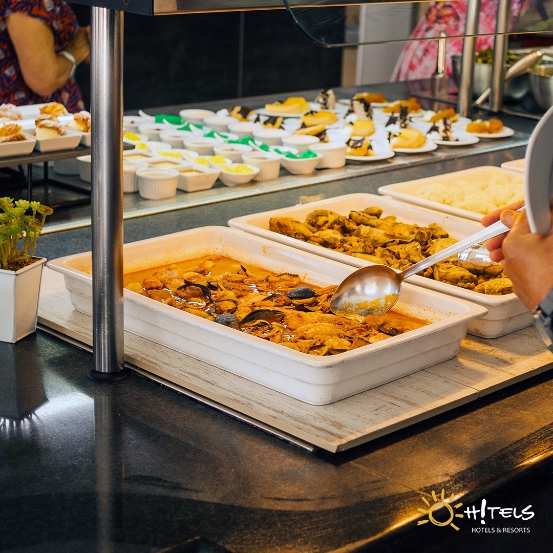 a buffet line with a sign that says hotels on it