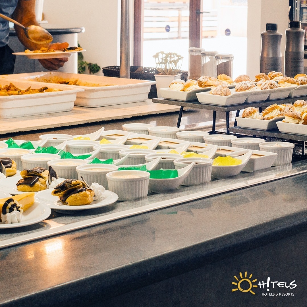 a buffet line with a sign that says hotels hotels & resorts