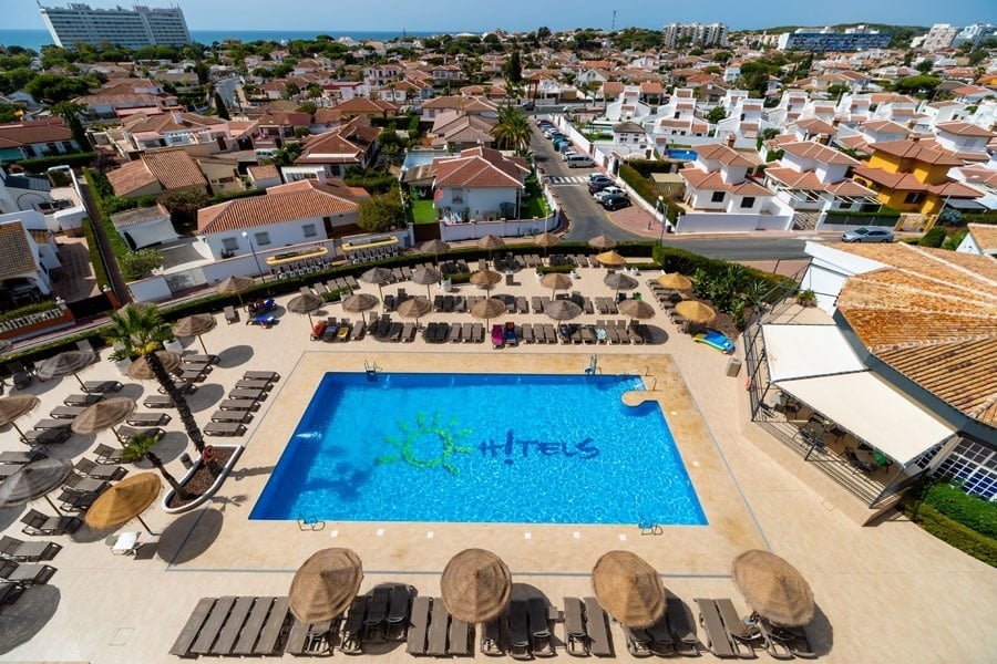 an aerial view of a hotel swimming pool