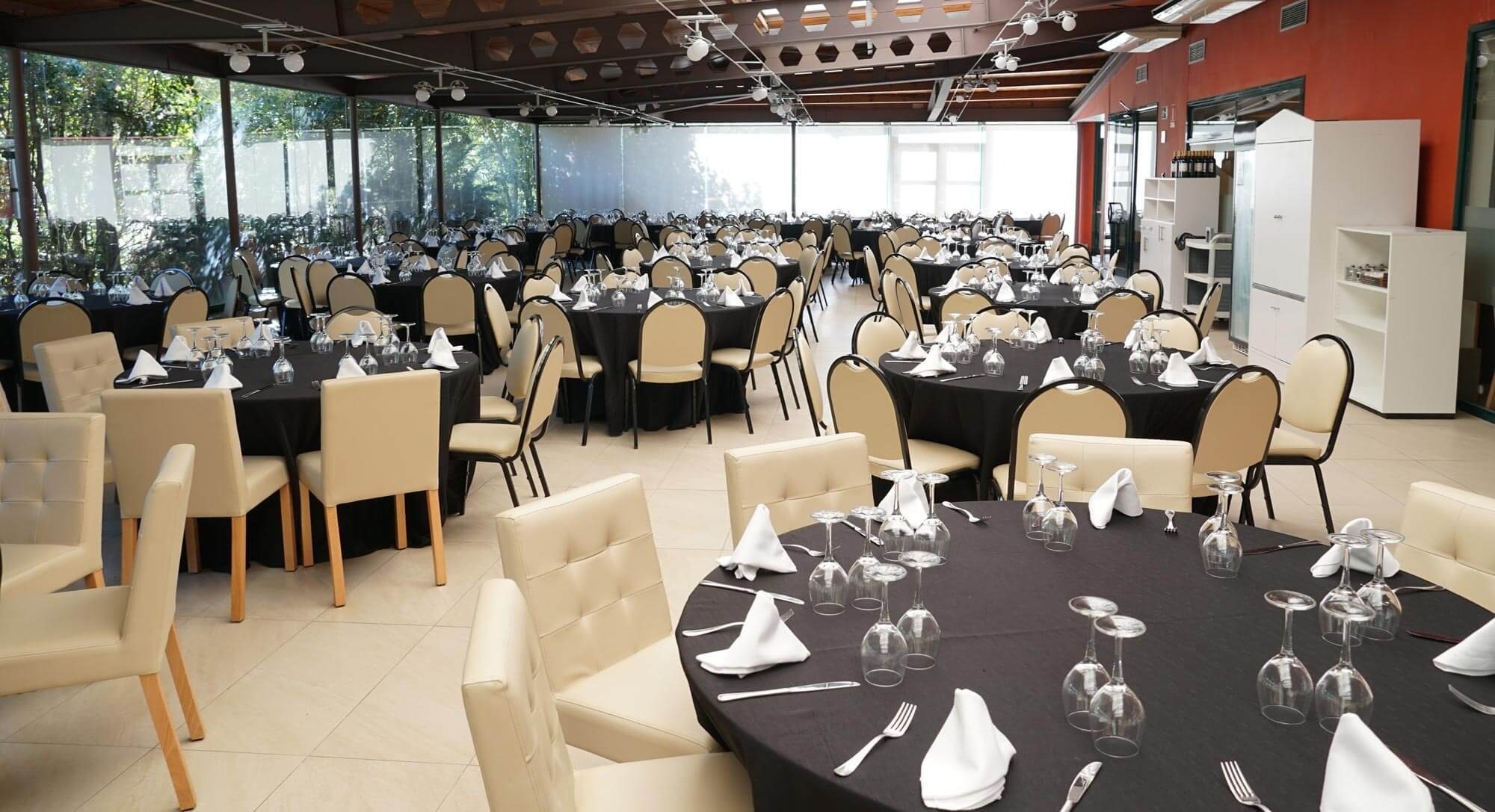 a large room with tables and chairs set up for a banquet