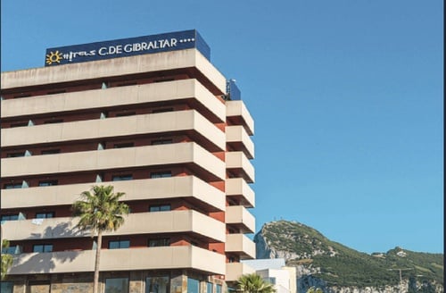 Hotel in La Linea de la Concepcion | Hotel Campo de Gibraltar: modern facade with balconies & view of The Rock.