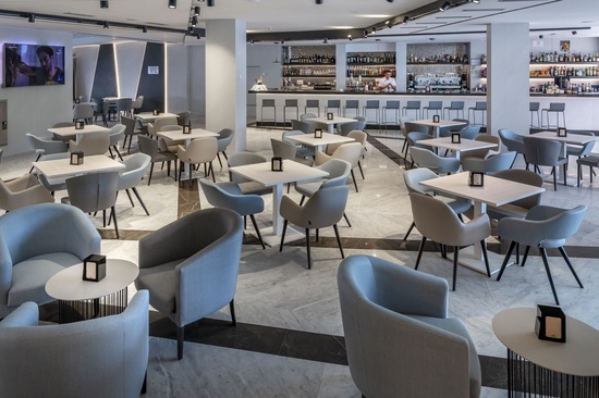 a restaurant with tables and chairs and a bar