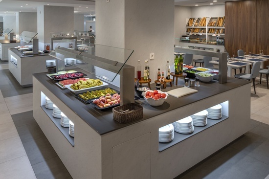 a buffet filled with a variety of fruits and vegetables