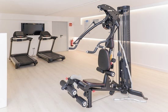 a gym with treadmills and a machine that says ' matrix ' on it