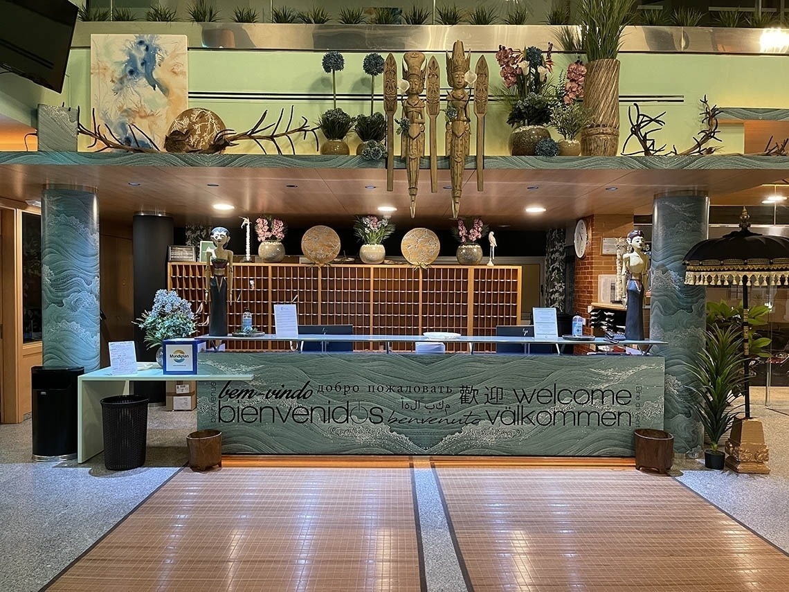 a reception area with a sign that says welcome