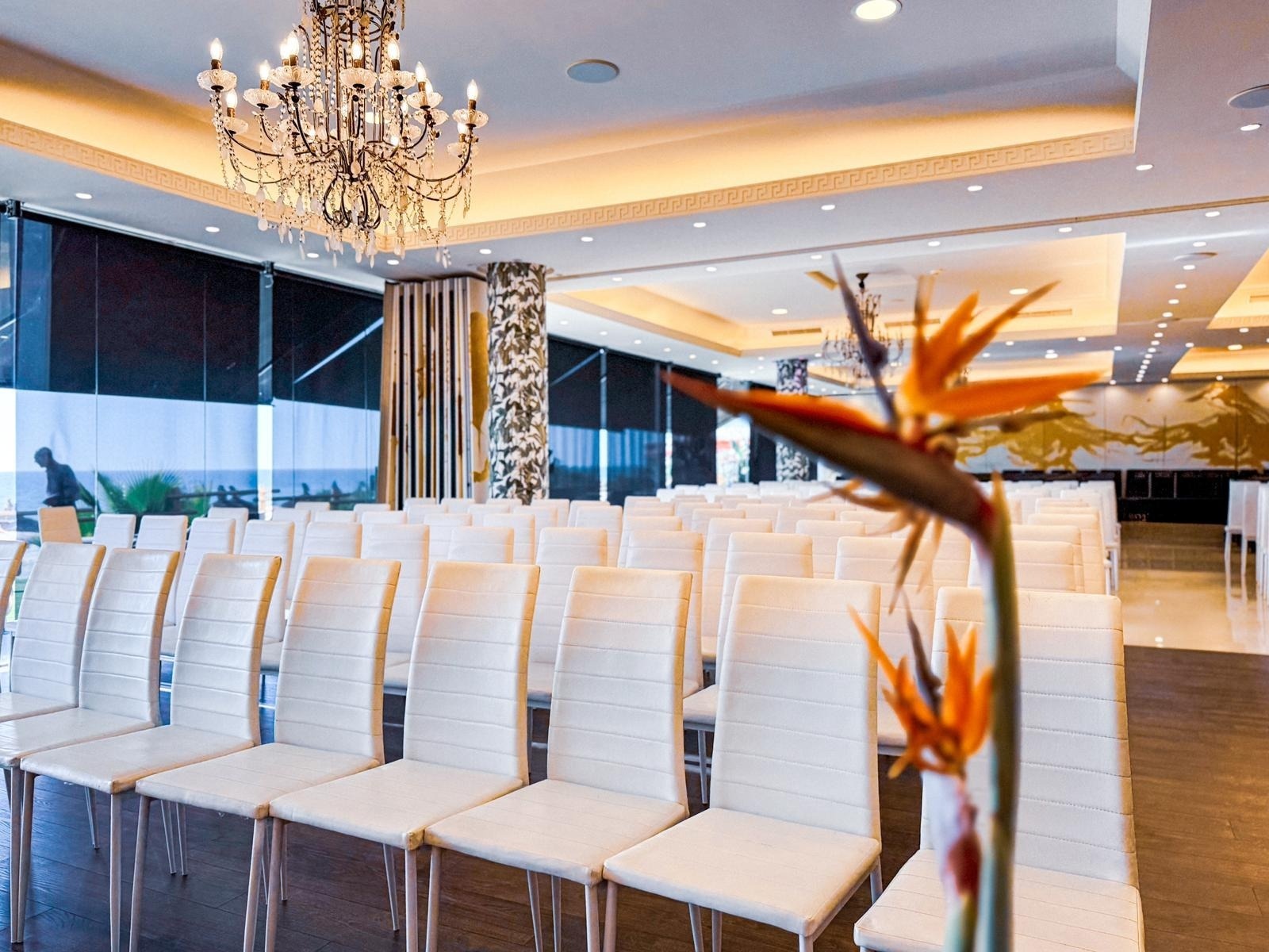 a large room with tables and chairs set up for a meeting