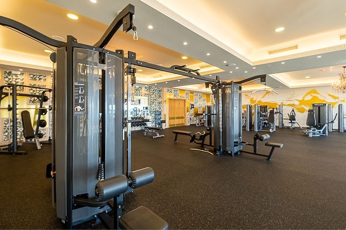 a large gym filled with lots of exercise equipment