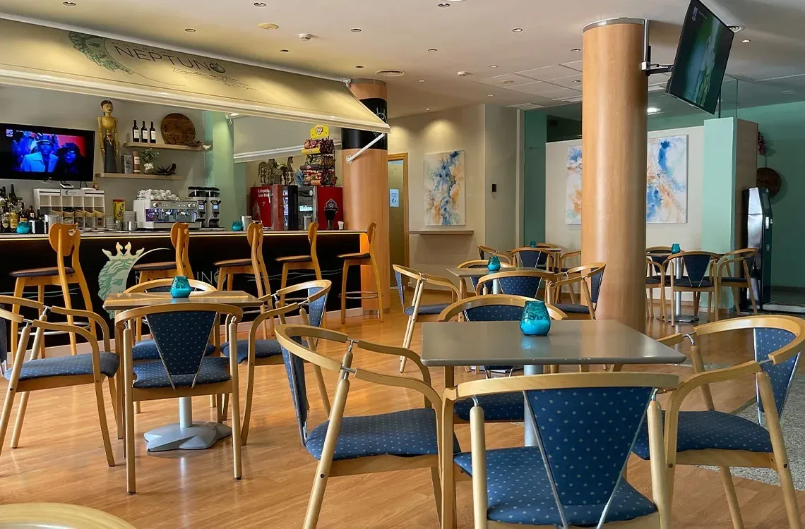 Stylish hotel cafe with blue tables and chairs, perfect for ON Hotels: ON Corporativa.
