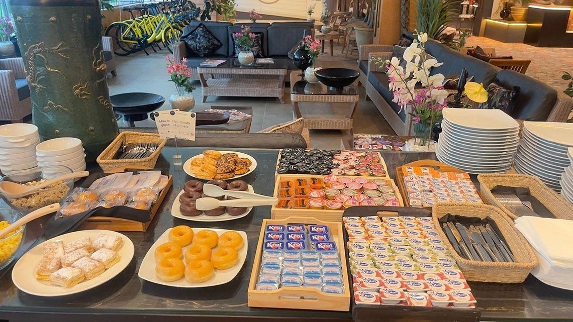 a table with a variety of food including kiwi yogurt