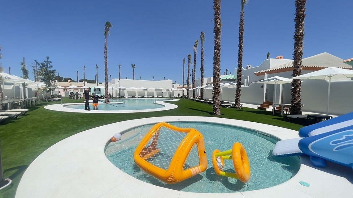 a swimming pool with a soccer goal in it