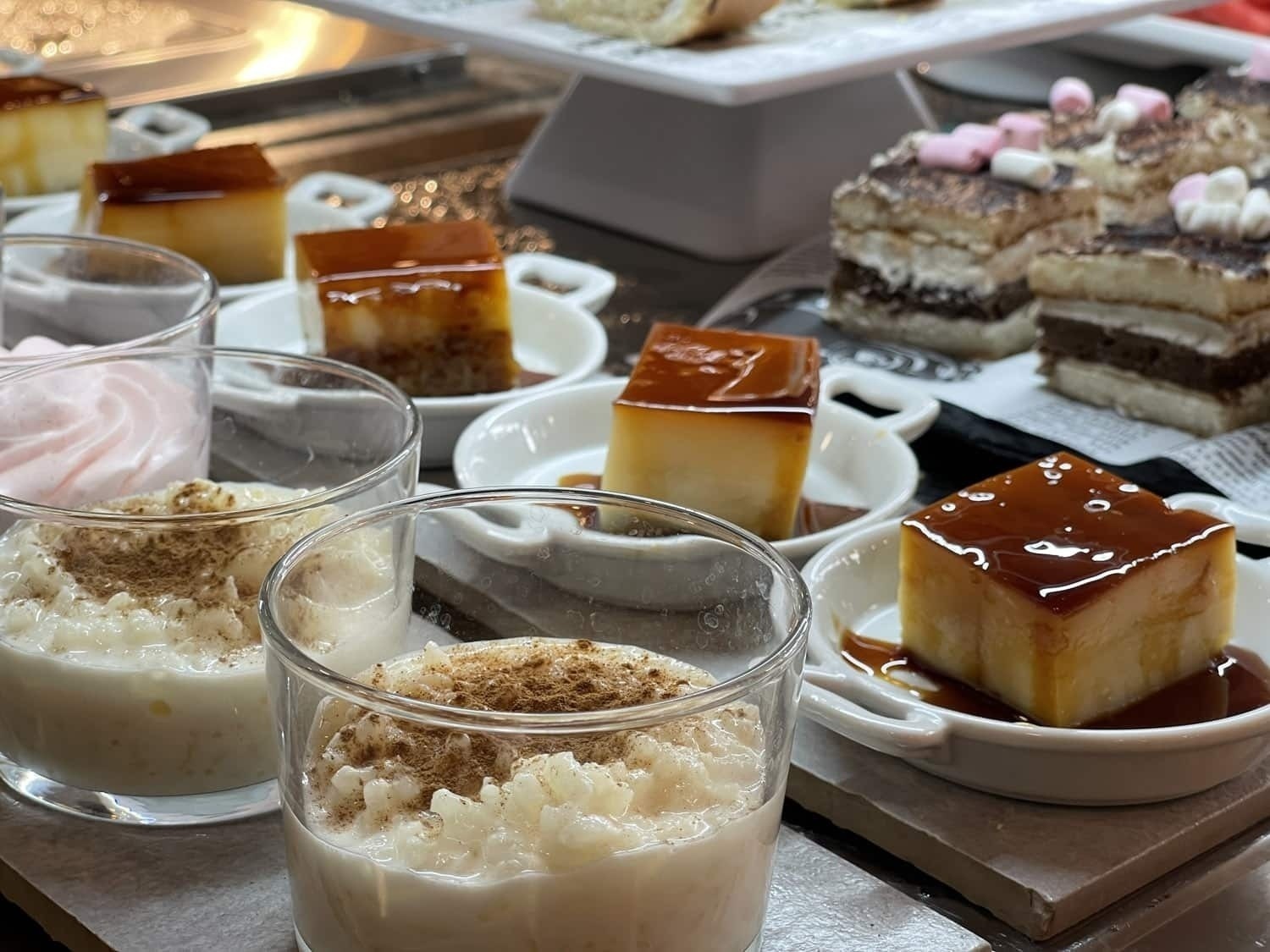 a variety of desserts are displayed on a table