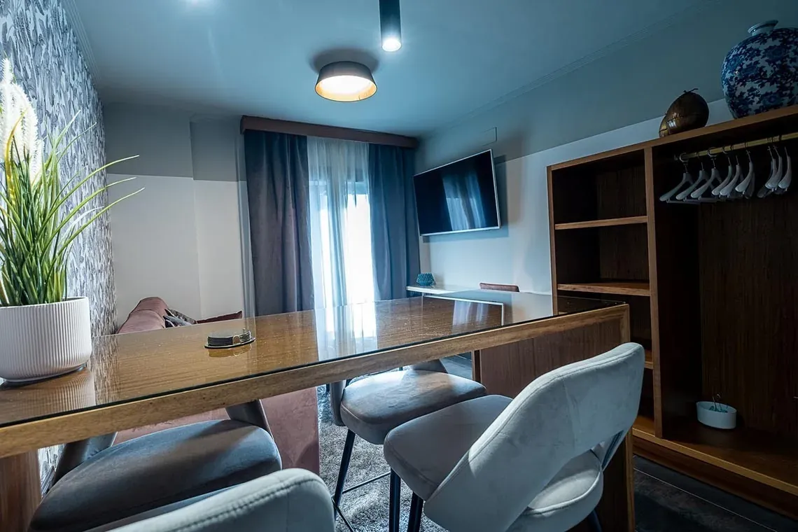 Dining area with chairs & table at ON Suites Seville | Adults only hotel.