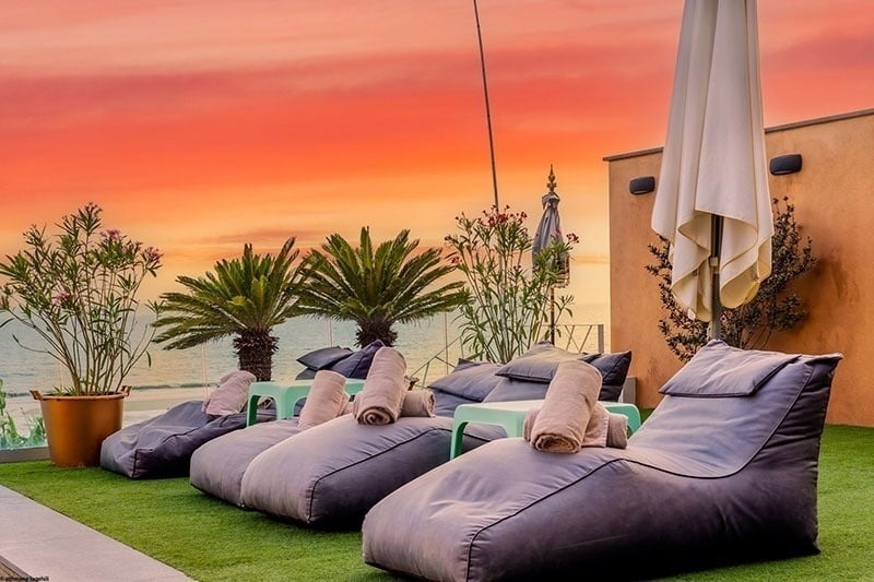 a row of bean bag chairs with towels on them