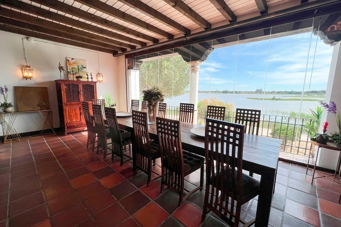 a restaurant with tables and chairs and statues of buddhas