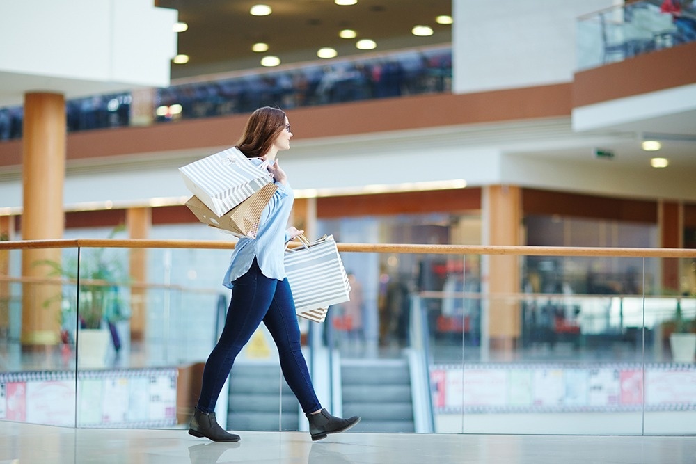 Woman shopping in a shopping center near the Ona Living Barcelona hotel