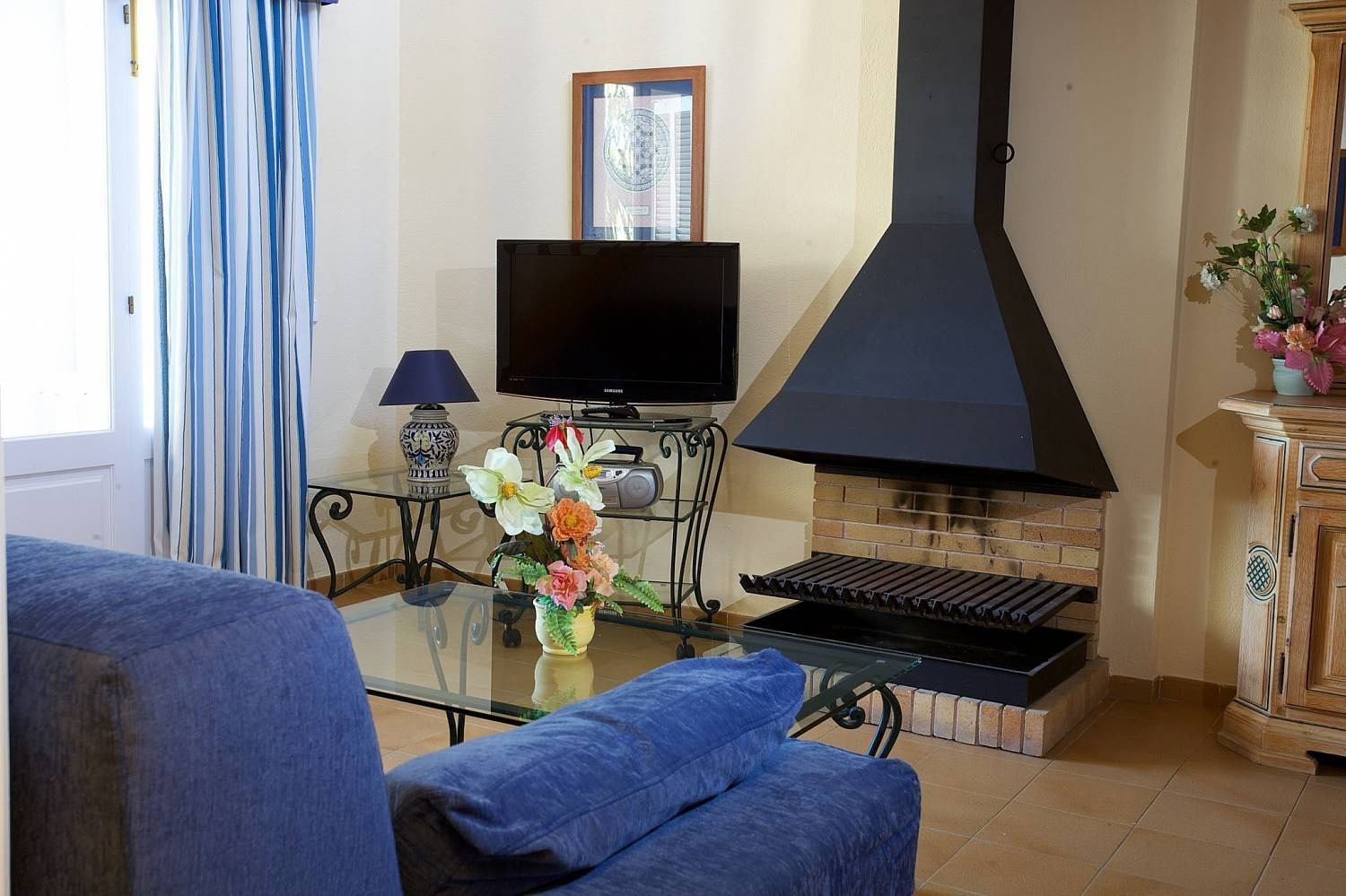 Living room with fireplace at the Ona Cala Pi hotel, in Majorca