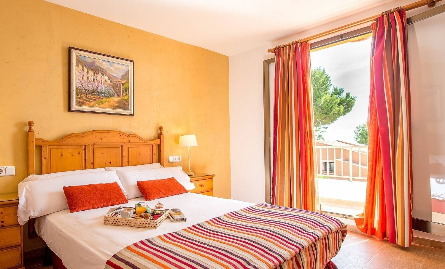 Bedroom with double bed at the Ona Aucanada hotel in the North of Majorca