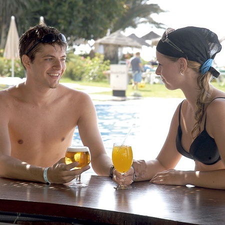Couple at the outdoor pool bar of the Hotel Ona Marinas in Nerja