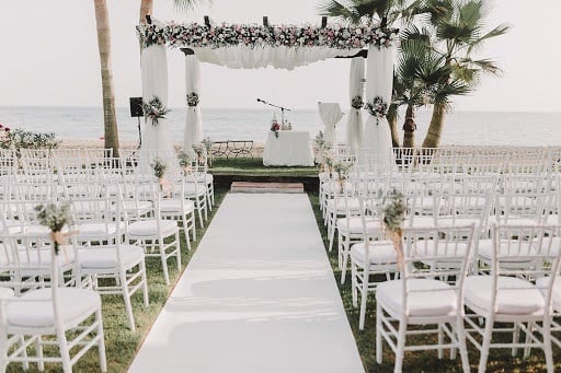 Detail with chairs and wedding altar on the beach of the Hotel Ona Marinas in Nerja
