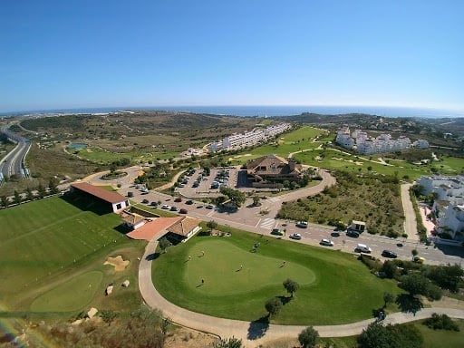Aerial panoramic view of the golf courses of the Ona Valle Romano Golf - Resort hotel