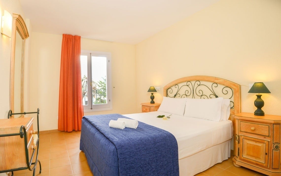 Bedroom with a double bed at the Ona Cala Pi hotel, in Majorca