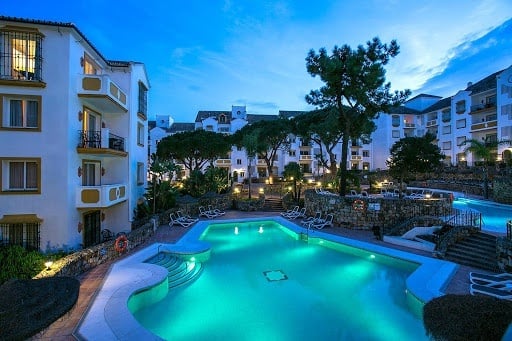 Outdoor pool at night at the Hotel Ona Alanda Club Marbella