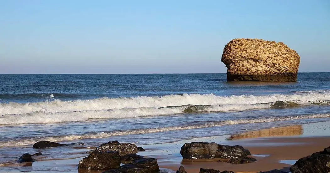 Rocky beach with sea rock. On Hotels: ON Corporativa.