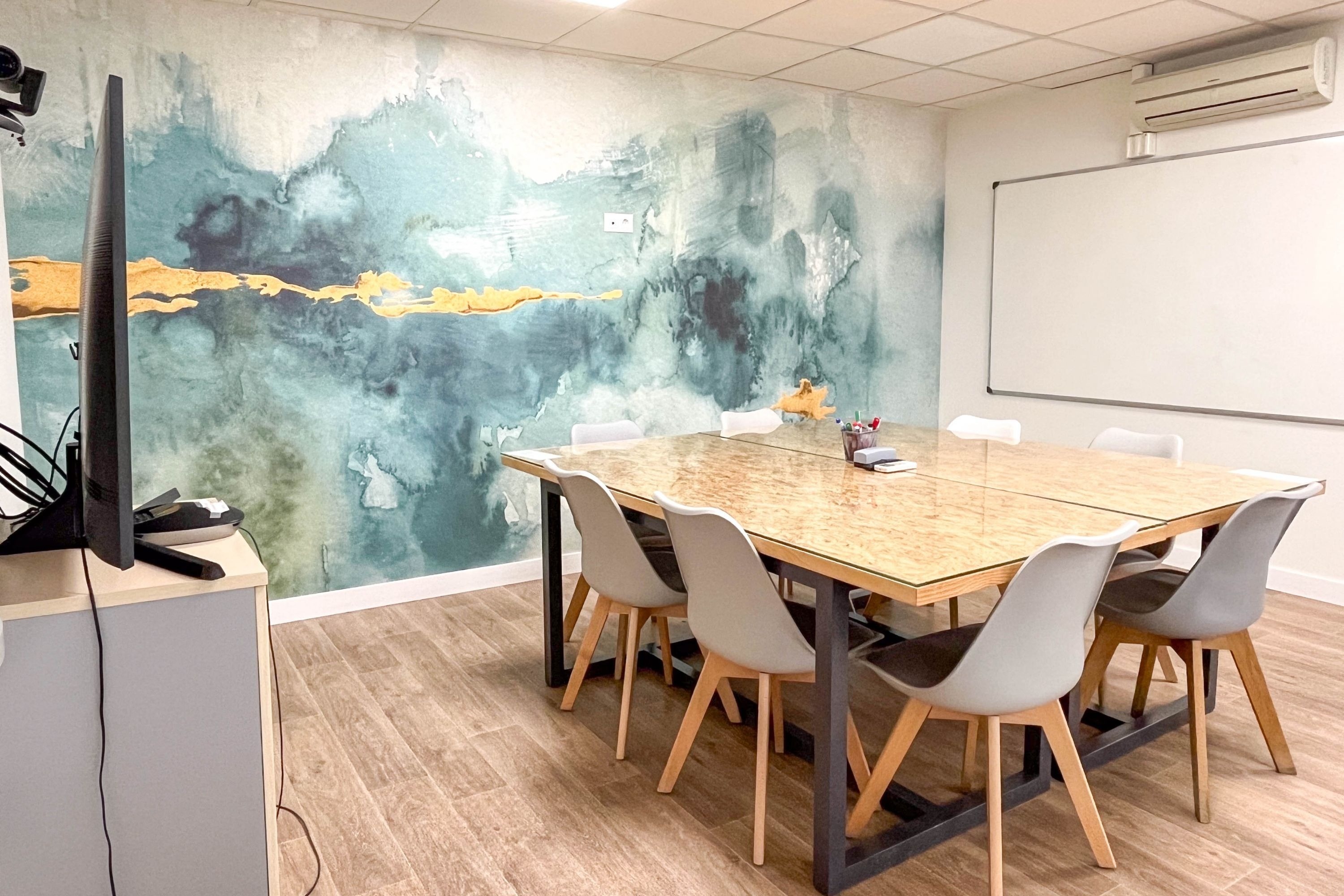 a conference room with a large table and chairs