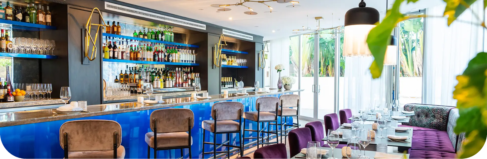 a woman is getting a massage with candles in the background