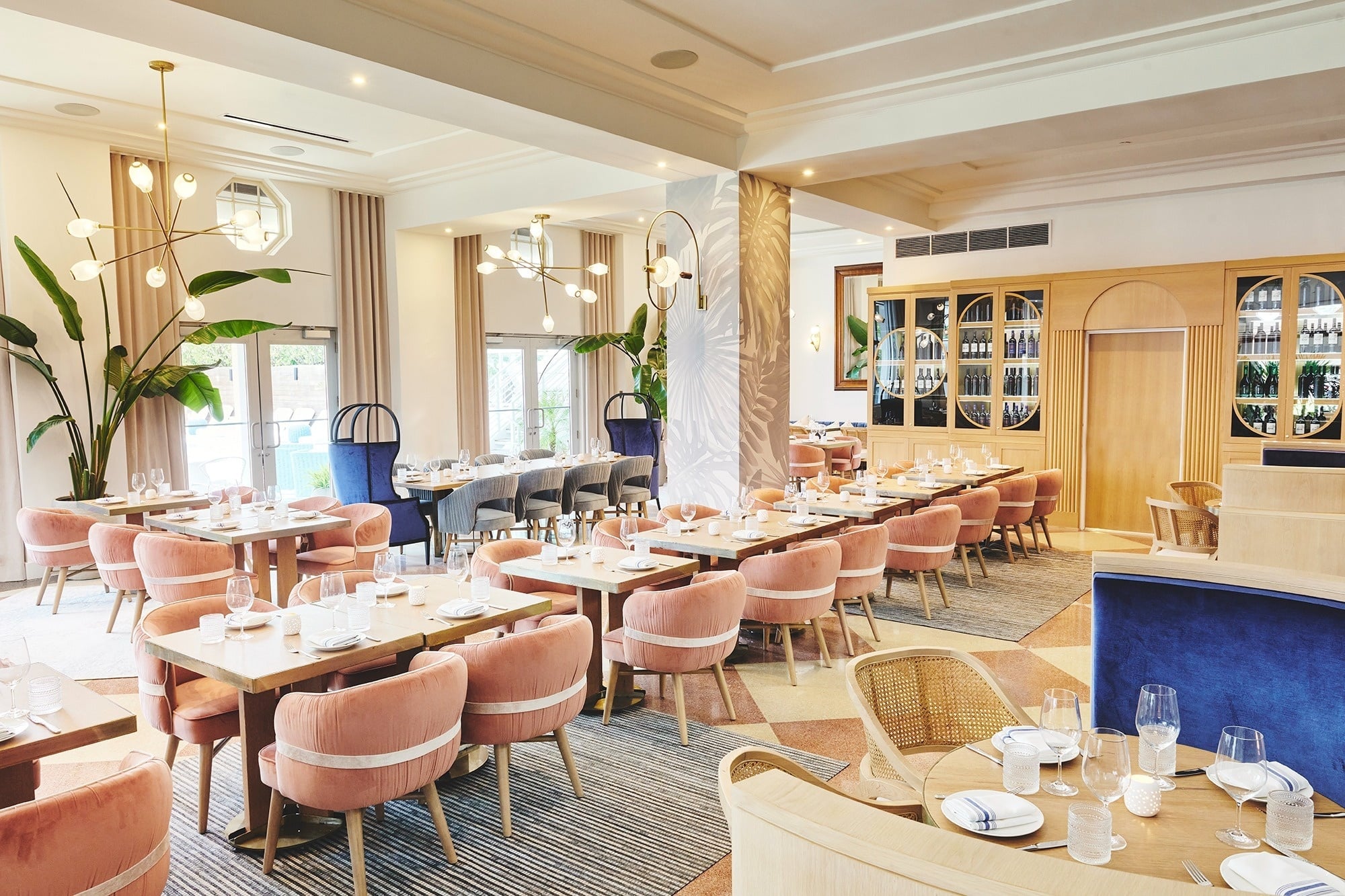 a woman is getting a massage with candles in the background