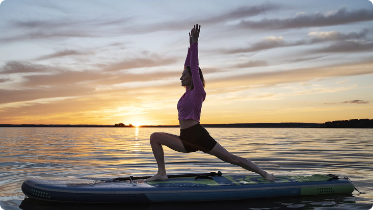 a woman is practicing yoga on a paddle board in the water