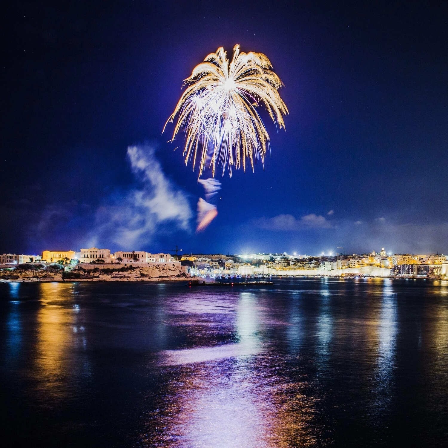 a fireworks display over a body of water