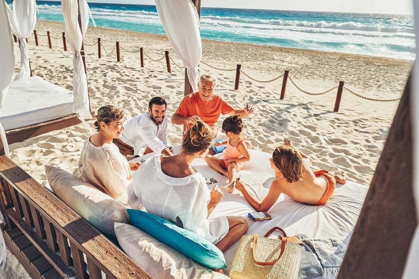 Family enjoys beach cabana at Hotel Grand Park Royal Cancun | Mexican Caribbean